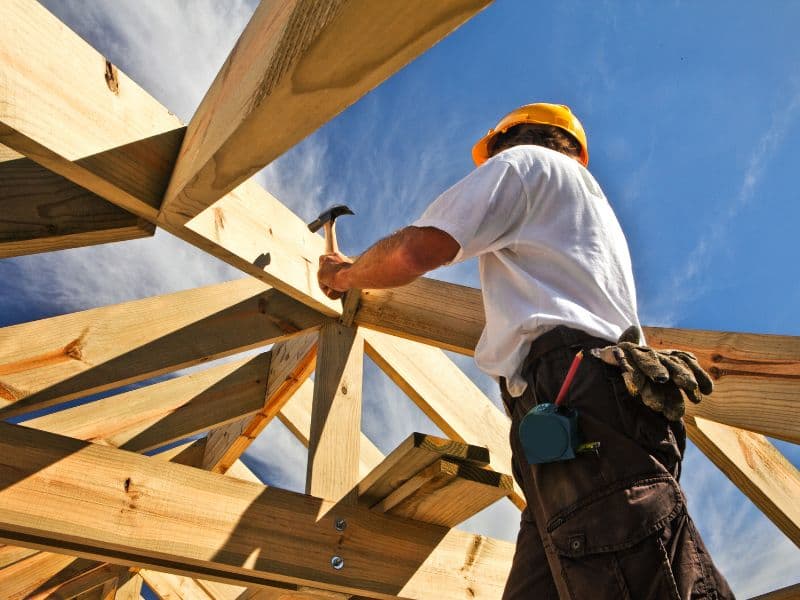 Builders reviewing drawings on site
